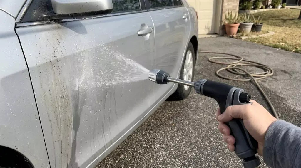 Power Blast Plus test on a silver family sedan — soft fan spray hitting the driver’s door directly