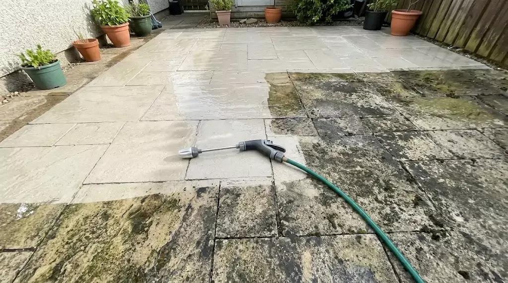 Power Blast Plus test on a 350-sq-ft stone patio — clear line between cleaned and uncleaned section